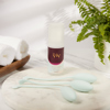 Product photo of a pelvic floor training set and a bottle of water-based lubricant on a circular stone slab. On the bottle, text reads: "my viv".